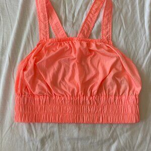 FP Movement Cropped work out top Lightweight material in neon orange. Size:S